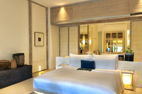 Luxury bedroom interior with rich furniture and scenic view from walkout deck